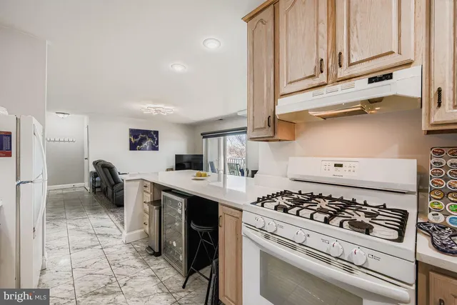 a kitchen with a stove and a refrigerator