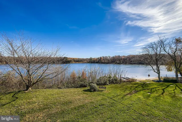 a view of lake with houses in the back