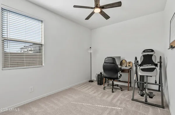 a bathroom with a sink mirror vanity and toilet