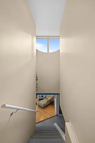 a bathroom with a window and a shower