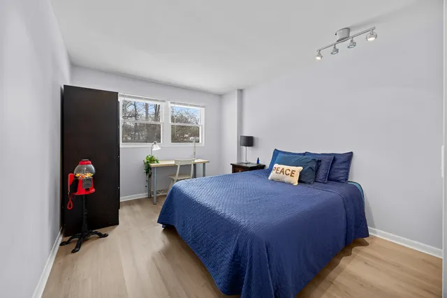 an empty room with windows and closet