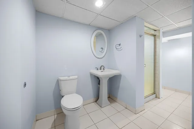 a kitchen with stainless steel appliances granite countertop a refrigerator a stove and a sink