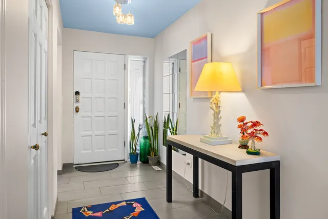 a table room with a table and a potted plant