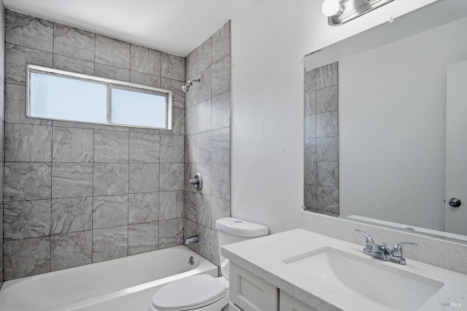 2537 Tamarisk Drive Santa Rosa, CA 95405 - Photo 19 of 25 a bathroom with a sink a toilet and shower