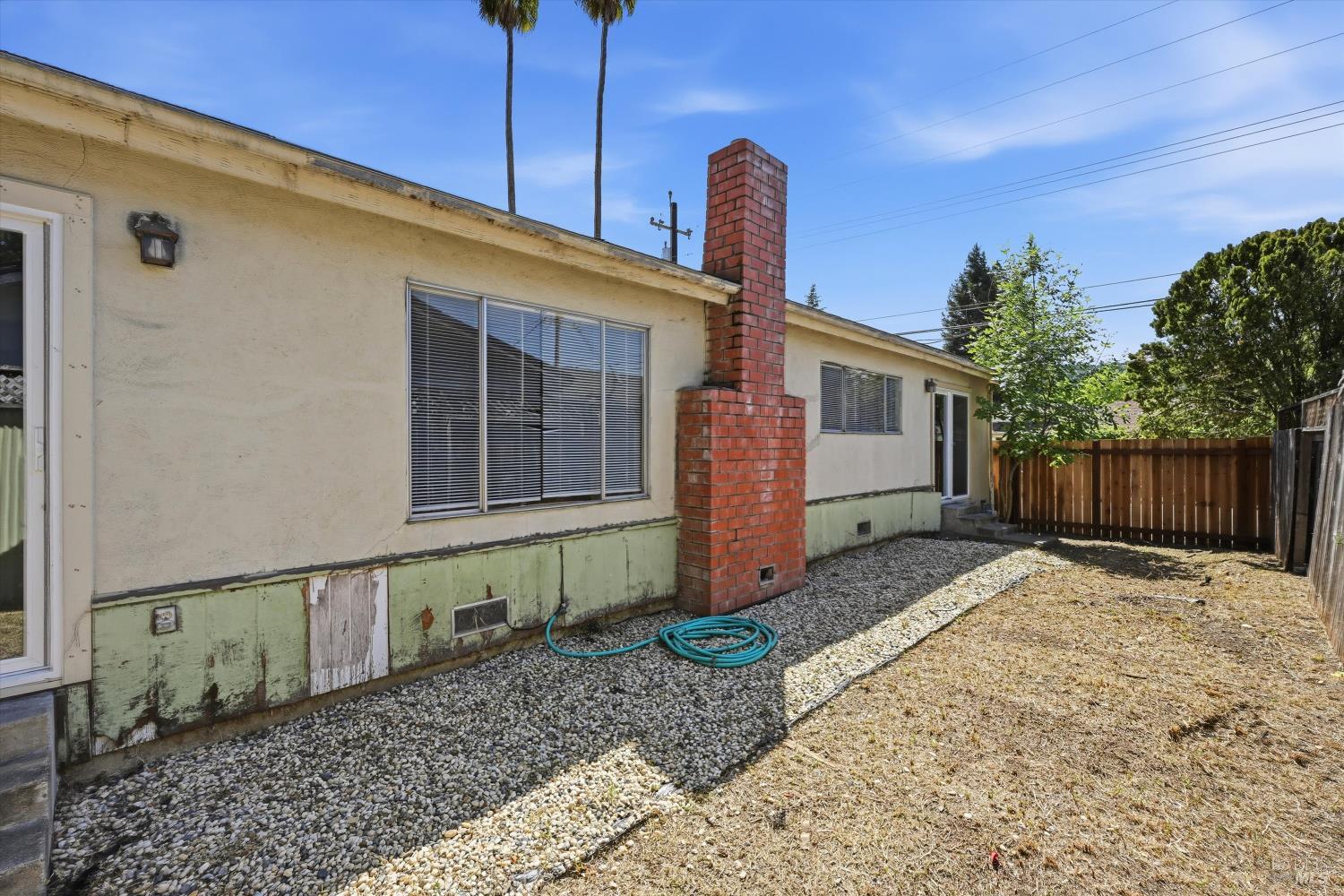 2537 Tamarisk Drive Santa Rosa, CA 95405 - Photo 21 of 25 a front view of a house with garden