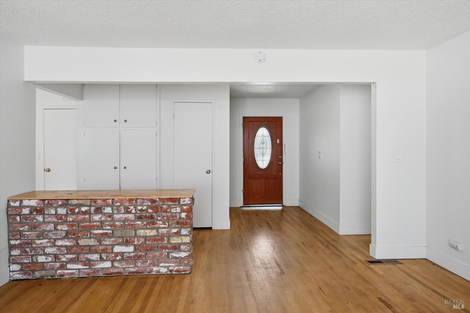 2537 Tamarisk Drive Santa Rosa, CA 95405 - Photo 4 of 25 a view of an empty room with window and wooden floor