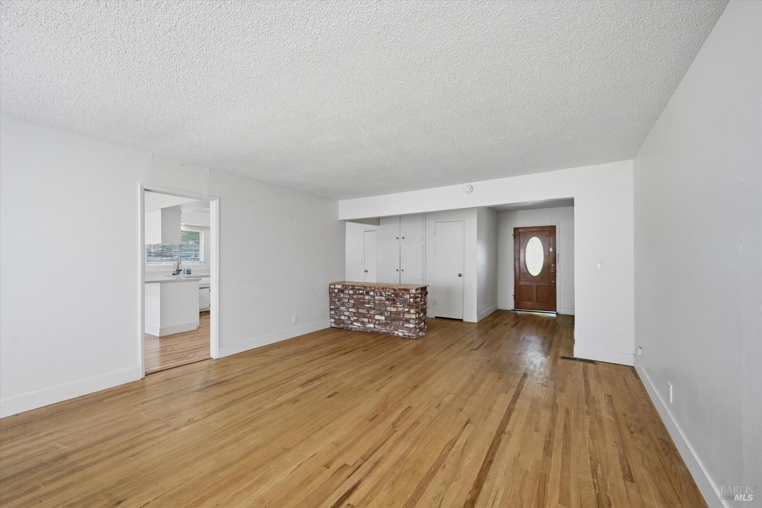 2537 Tamarisk Drive Santa Rosa, CA 95405 - Photo 5 of 25 a bedroom with a bed and wooden floor