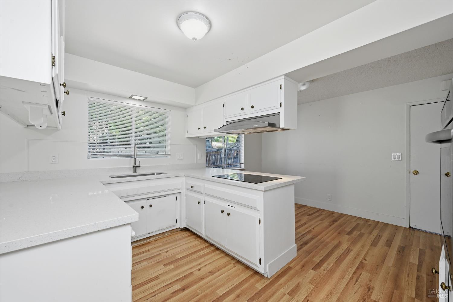 2537 Tamarisk Drive Santa Rosa, CA 95405 - Photo 7 of 25 a kitchen with a sink stove and cabinets
