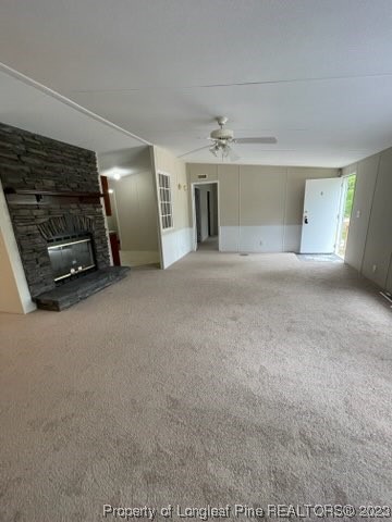 981 Black Road Cameron, NC 28326 - Photo 12 of 39 a view of a livingroom with furniture and a fireplace