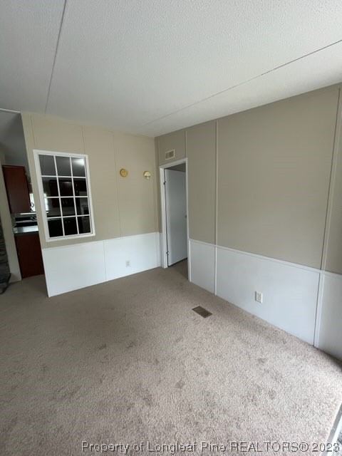 981 Black Road Cameron, NC 28326 - Photo 15 of 39 an empty room with windows