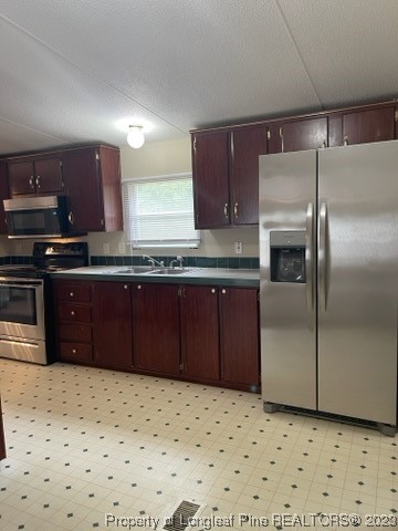 981 Black Road Cameron, NC 28326 - Photo 18 of 39 a kitchen with stainless steel appliances a refrigerator and a sink