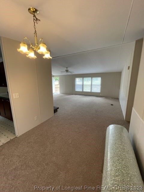 981 Black Road Cameron, NC 28326 - Photo 24 of 39 a view of a livingroom with a chandelier fan and windows