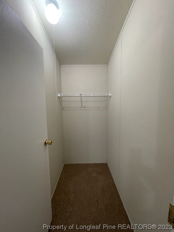 981 Black Road Cameron, NC 28326 - Photo 29 of 39 a view of a room with racks on the wall