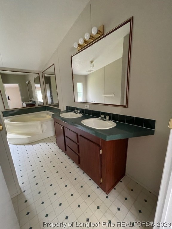 981 Black Road Cameron, NC 28326 - Photo 36 of 39 a bathroom with a sink a vanity and mirror