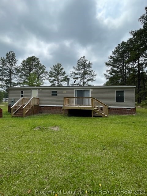 981 Black Road Cameron, NC 28326 - Photo 4 of 39 a view of a house with a yard