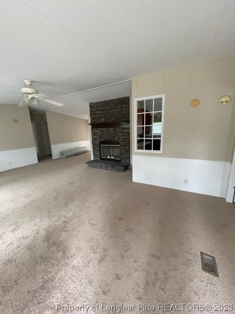 981 Black Road Cameron, NC 28326 - Photo 9 of 39 a view of an empty room with a fireplace and a window