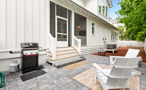 a view of backyard with seating area