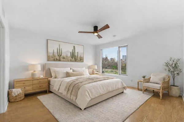 a bedroom with a bed and a chair