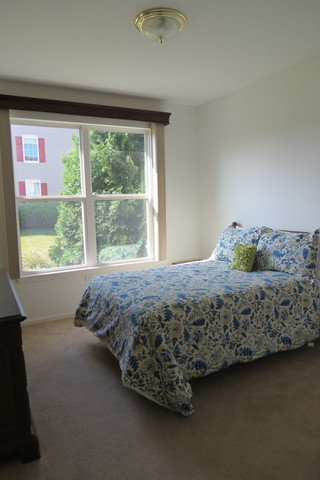 992 Oak Ridge Boulevard Elgin, IL 60120 - Photo 16 of 25 a bed sitting in a bedroom next to a window
