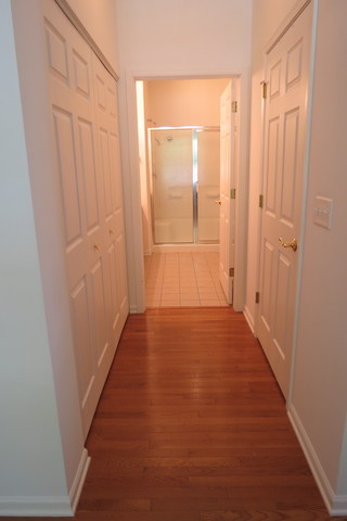 992 Oak Ridge Boulevard Elgin, IL 60120 - Photo 20 of 25 a view of a hallway with wooden floor