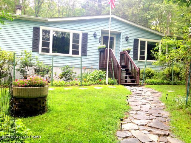 3113 Bear Road Bushkill, PA 18324 - Photo 1 of 38 a front view of a house with garden