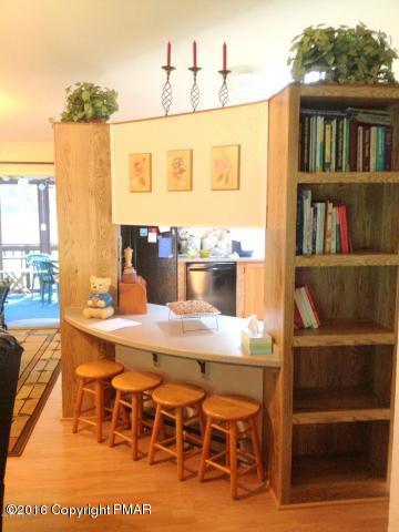 3113 Bear Road Bushkill, PA 18324 - Photo 12 of 38 a dining table with chairs and wooden floor