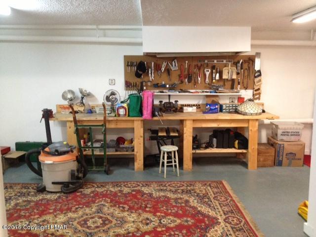 3113 Bear Road Bushkill, PA 18324 - Photo 27 of 38 a living room with a rug and a table