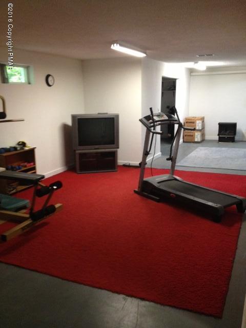 3113 Bear Road Bushkill, PA 18324 - Photo 30 of 38 a living room with furniture and a flat screen tv