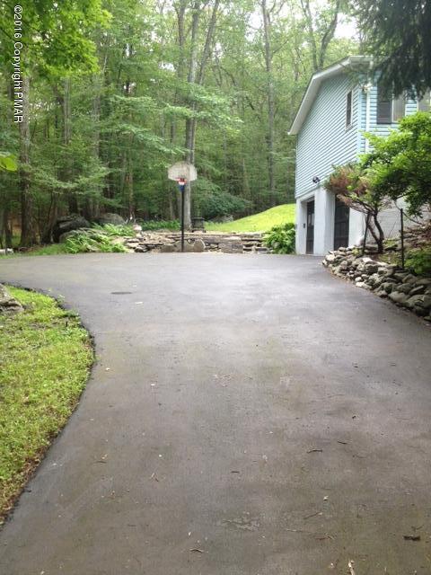 3113 Bear Road Bushkill, PA 18324 - Photo 35 of 38 a view of a house with backyard and trees