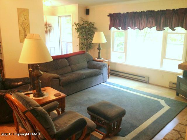 3113 Bear Road Bushkill, PA 18324 - Photo 4 of 38 a living room with furniture and a large window