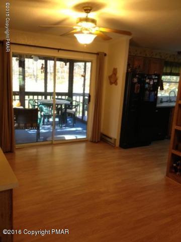 3113 Bear Road Bushkill, PA 18324 - Photo 6 of 38 a view of a livingroom with furniture and floor to ceiling window