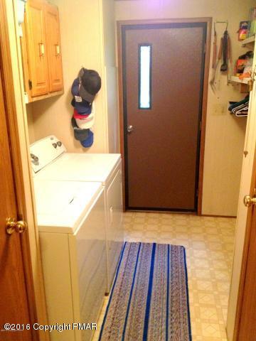 3113 Bear Road Bushkill, PA 18324 - Photo 8 of 38 a bathroom with a sink and mirror