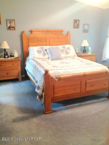 3113 Bear Road Bushkill, PA 18324 - Photo 9 of 38 a bedroom with a bed and a window