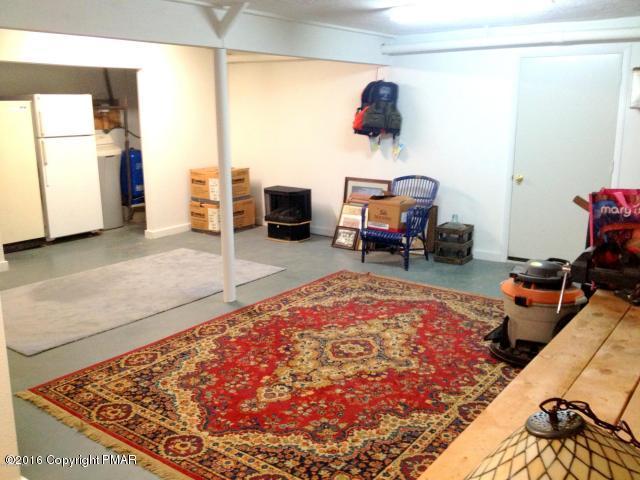 3113 Bear Road Bushkill, PA 18324 - Photo 10 of 38 a living room with furniture and a rug