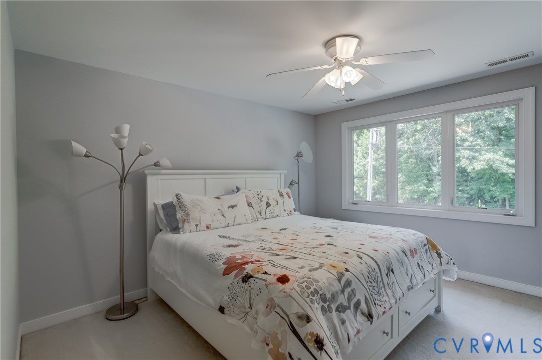 7902 Johnson Road Petersburg, VA 23805 - Photo 44 of 55 Bedroom featuring light gray walls, white trim, a