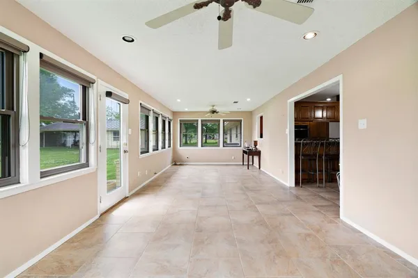 a view of an entryway with wooden floor and a window