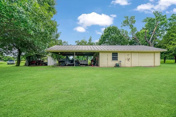 a view of a house with a backyard