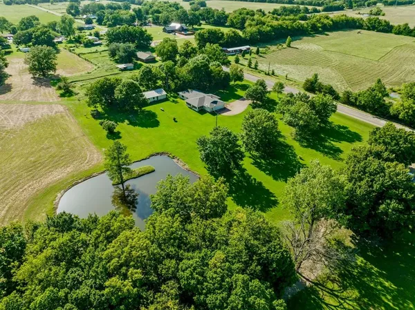 a view of a lake with a yard
