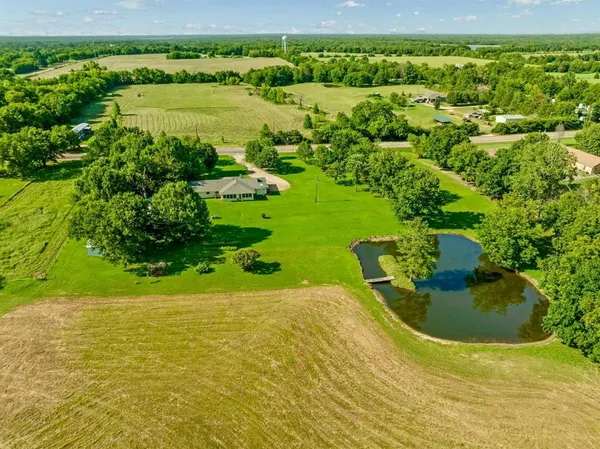 a view of a lake with a yard