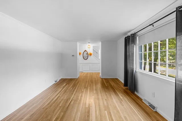 a view of wooden floor in an empty room