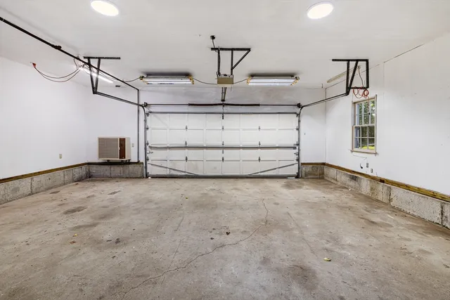 a view of a house with wooden fence