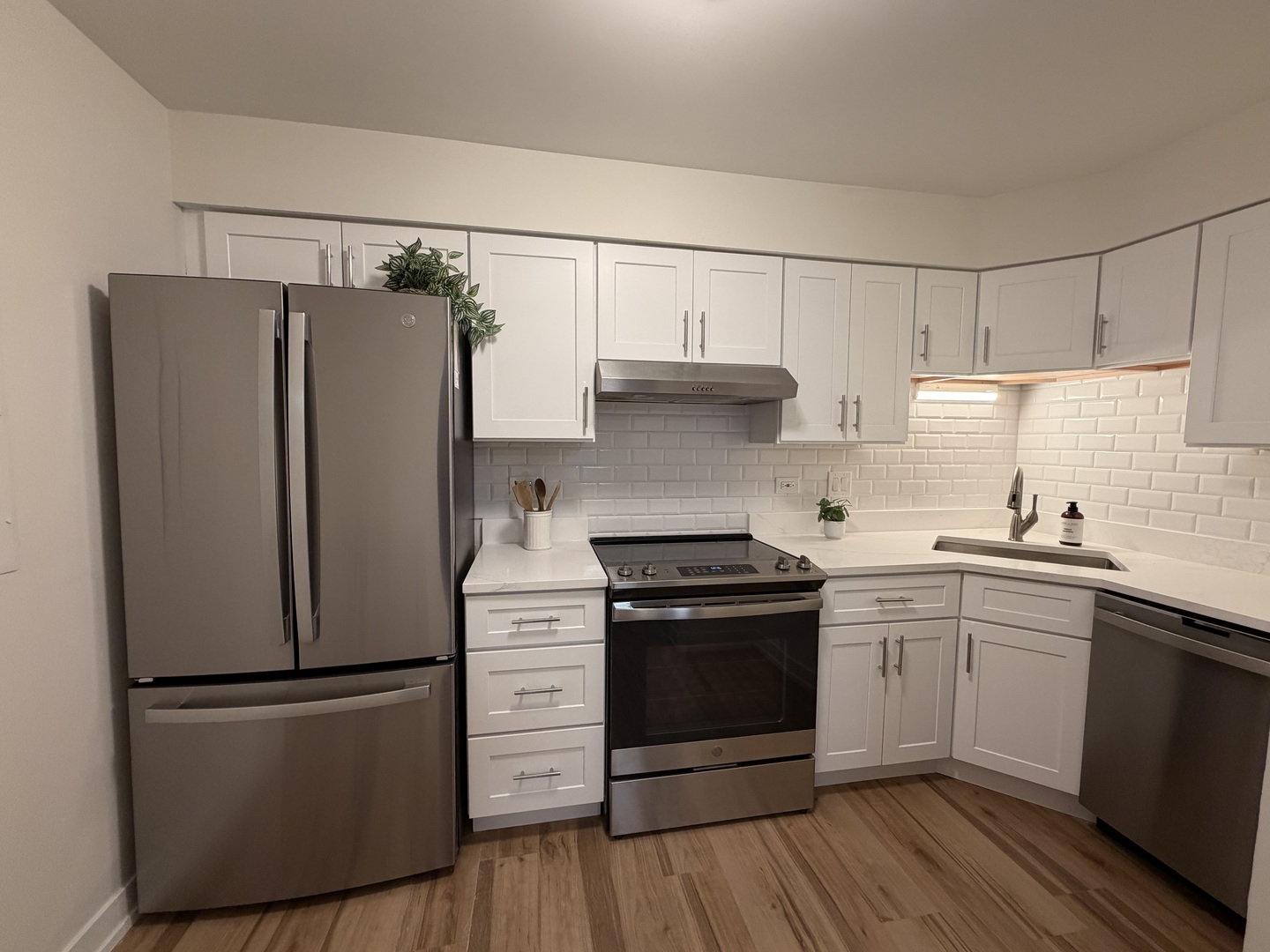 607 West Central Road, Unit A4 Mount Prospect, IL 60056 - Photo 4 of 13 a kitchen with stainless steel appliances a refrigerator stove and sink