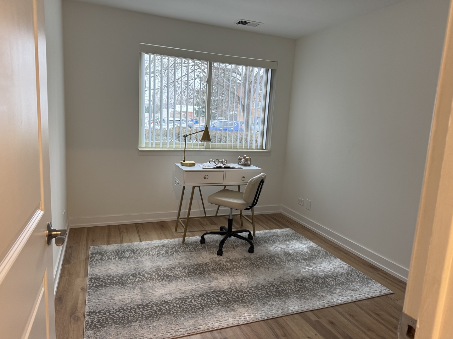 607 West Central Road, Unit A4 Mount Prospect, IL 60056 - Photo 10 of 13 a view of a workspace with furniture and a window