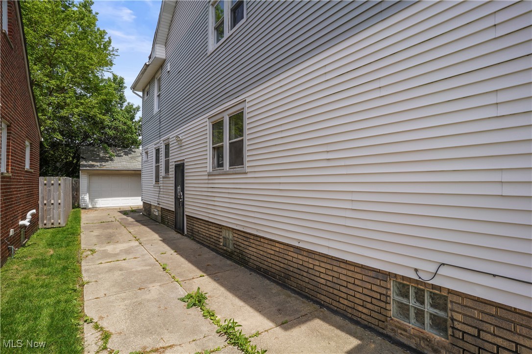 18039 Neff Road Cleveland, OH 44119 - Photo 2 of 3 View of home's exterior with a garage