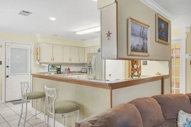 a living room with furniture a rug and a window