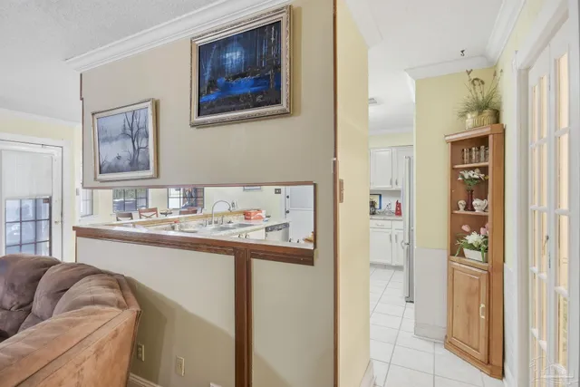 a kitchen with a stove a sink and a refrigerator
