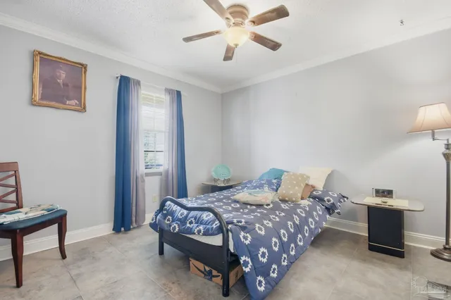 a bathroom with a sink a toilet and a large mirror
