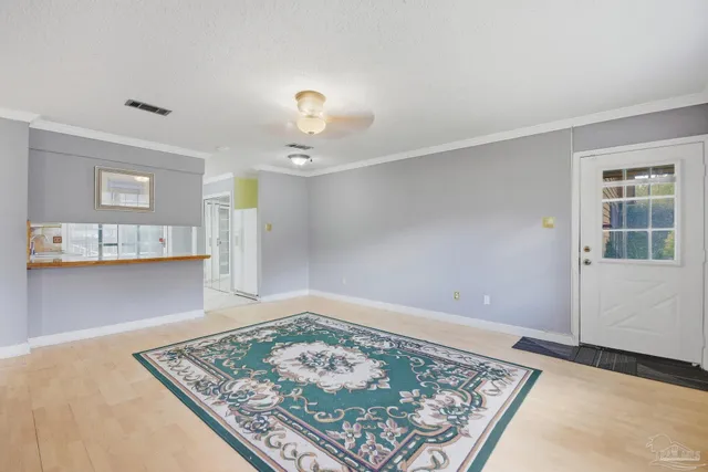 a view of an empty room with a window