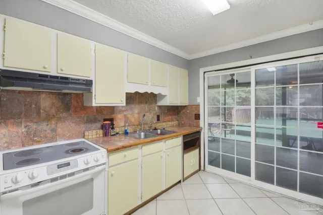 a living room with a floor to ceiling window and a table