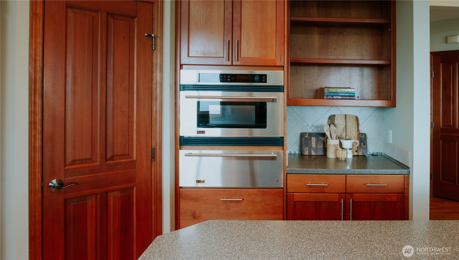 975 Simmons Road Port Angeles, WA 98362 - Photo 7 of 40 a kitchen with stainless steel appliances granite countertop a refrigerator and cabinets